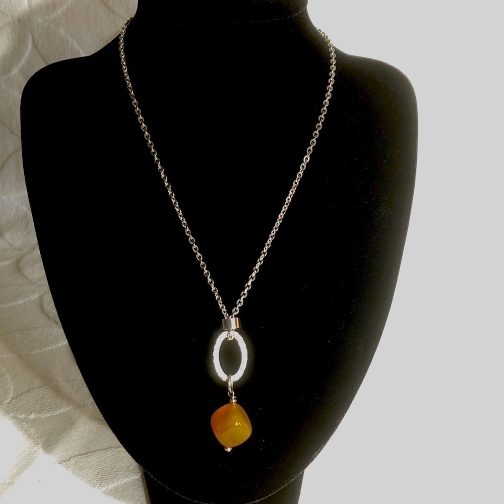 Abraxas silver toned necklace with gold coloured pendant, new without tags